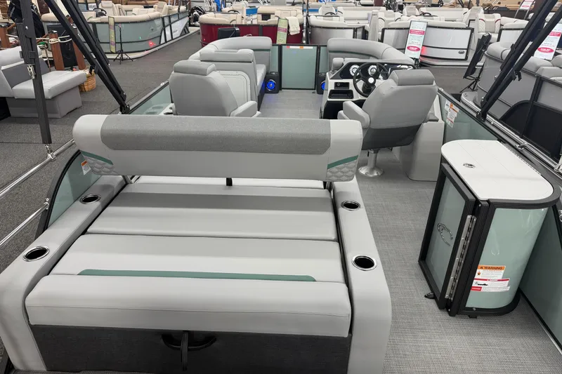 Slide: The Image of 2026 Crest Conquest 230 SLSC pontoon boat interior with modern seating and helm. - 14