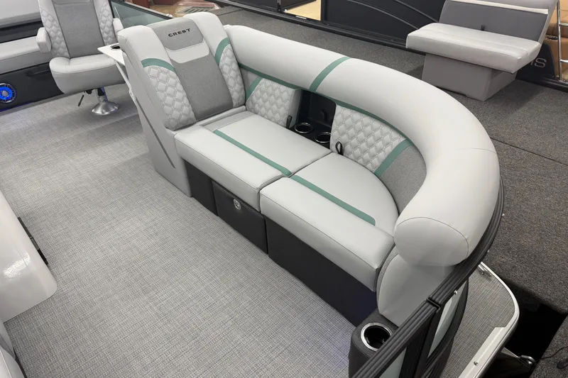 Slide: The Image of Luxurious seating on the 2026 Crest Conquest 230 SLSC pontoon boat, featuring elegant upholstery. - 3