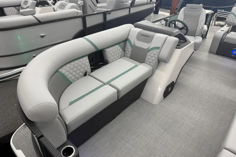 Slide: The Image of Luxurious interior of 2026 Crest Conquest 230 SLSC pontoon boat with plush seating. - 4