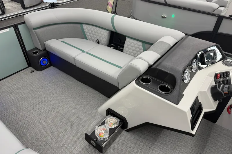 Slide: The Image of Luxurious interior of 2026 Crest Conquest 230 SLSC pontoon boat with modern seating and controls. - 7