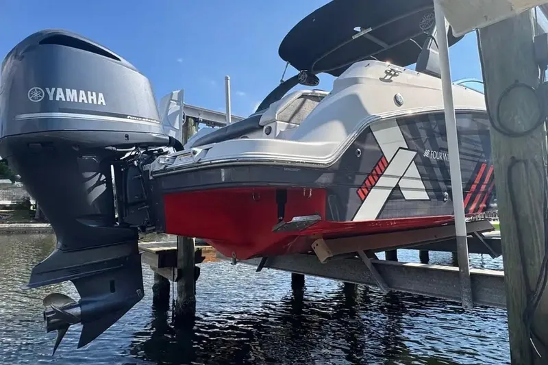 Slide: The Image of 2017 Four Winns HD240 boat with Yamaha outboard motor on a lift. - 4