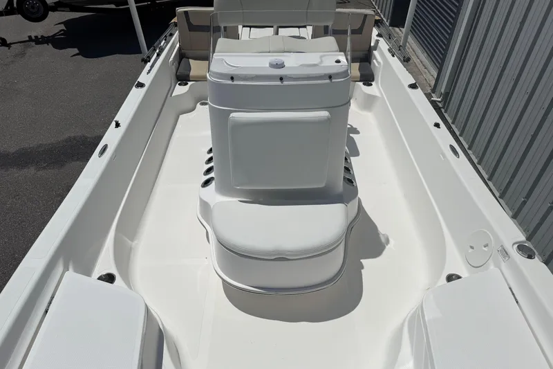Slide: The Image of 2019 Aquasport 224 Bay boat interior with seating and storage compartments. - 15