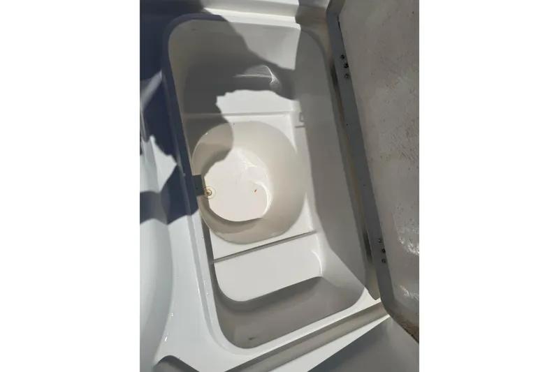 Slide: The Image of Open storage compartment in 2019 Aquasport 224 Bay boat. - 17