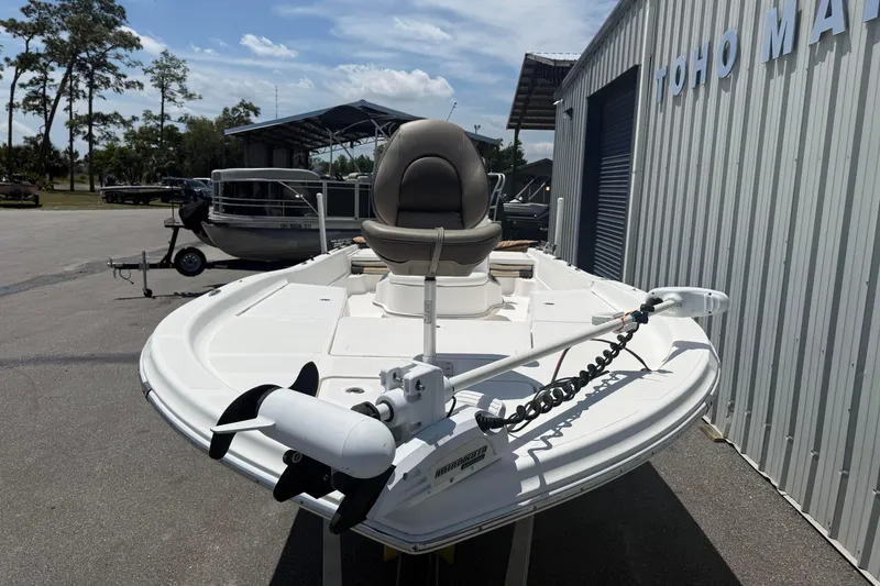 Slide: The Image of 2019 Aquasport 224 Bay boat with trolling motor, parked at marina. - 8