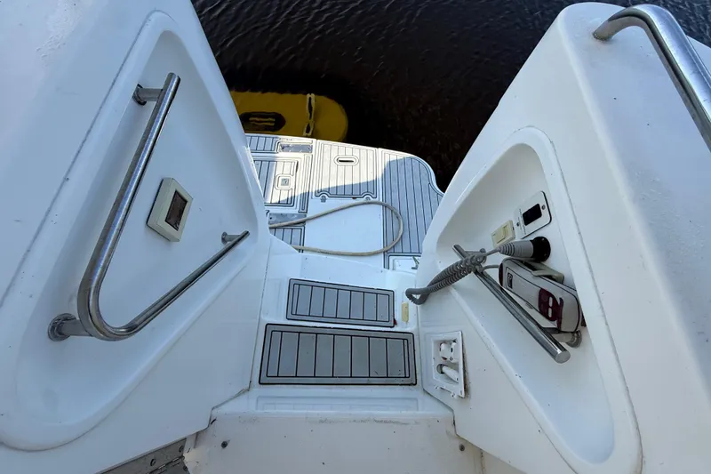 Slide: The Image of 2002 Cruisers Yachts 4450 Express Motoryacht deck with steps and railing. - 14
