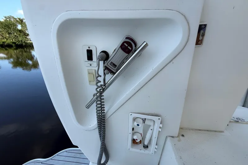 Slide: The Image of Control panel on 2002 Cruisers Yachts 4450 Express Motoryacht, featuring hydraulic and electrical components. - 17