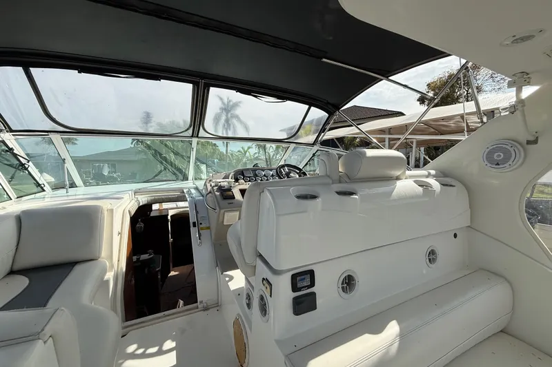 Slide: The Image of 2002 Cruisers Yachts 4450 Express Motoryacht cockpit with helm and seating area. - 18