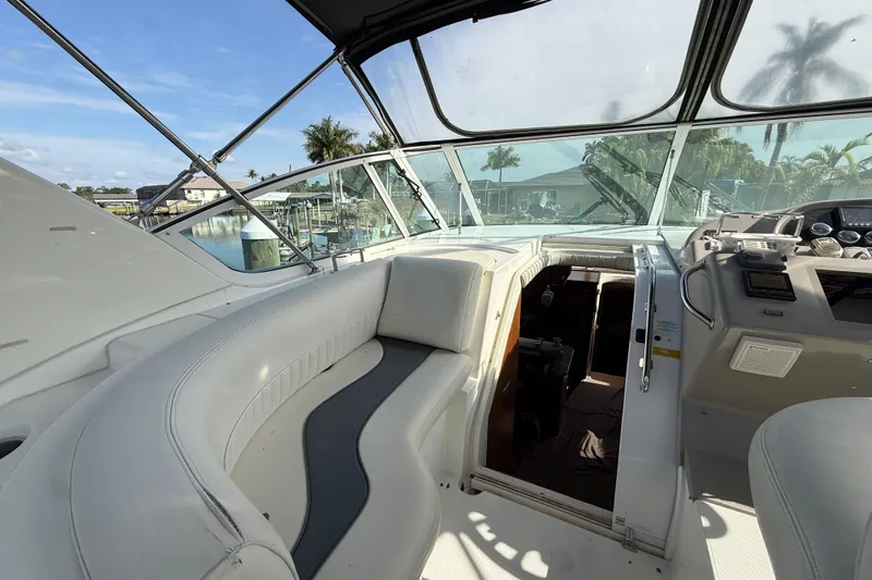 Slide: The Image of 2002 Cruisers Yachts 4450 Express Motoryacht cockpit with seating and helm, dockside view. - 20