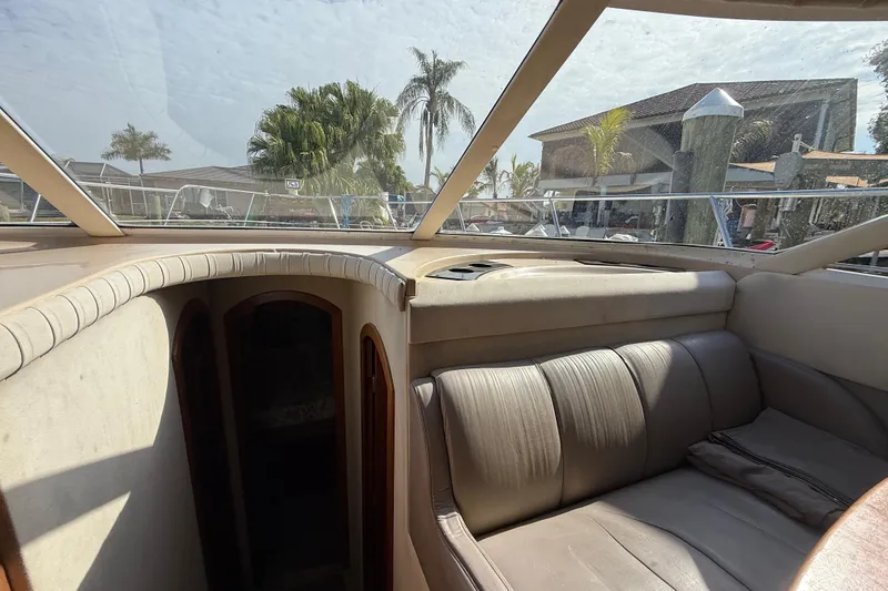 Slide: The Image of Interior view of 2002 Cruisers Yachts 4450 Express Motoryacht with seating and windows. - 22