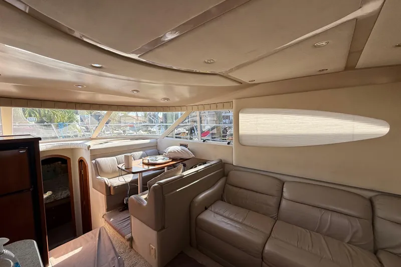 Slide: The Image of Luxurious interior of 2002 Cruisers Yachts 4450 Express Motoryacht with leather seating and dining area. - 23