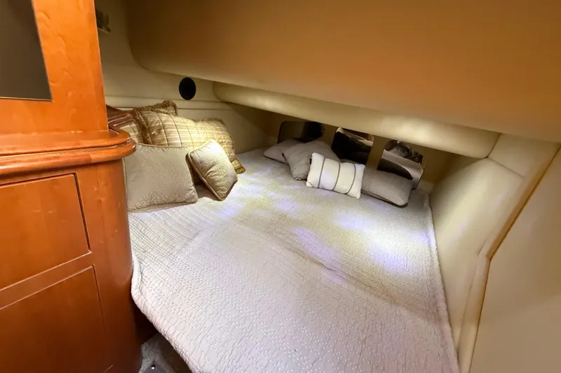 Slide: The Image of Luxurious cabin interior of 2002 Cruisers Yachts 4450 Express Motoryacht with plush bedding. - 32