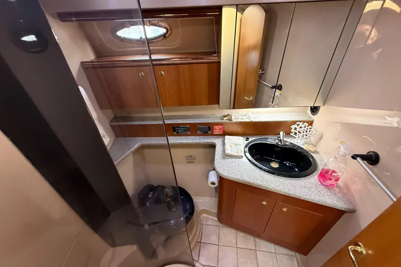 Slide: The Image of Luxurious bathroom in 2002 Cruisers Yachts 4450 Express Motoryacht with modern amenities. - 33