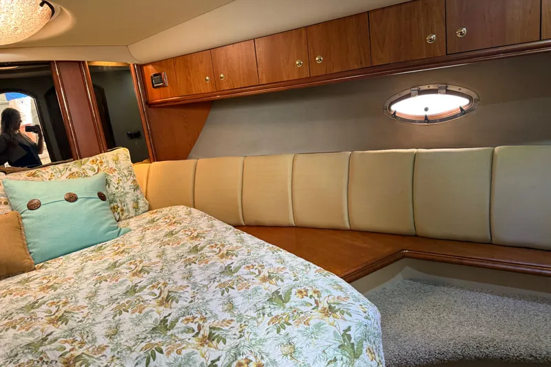 Slide: The Image of Luxurious cabin interior of 2002 Cruisers Yachts 4450 Express Motoryacht with floral bedding. - 35
