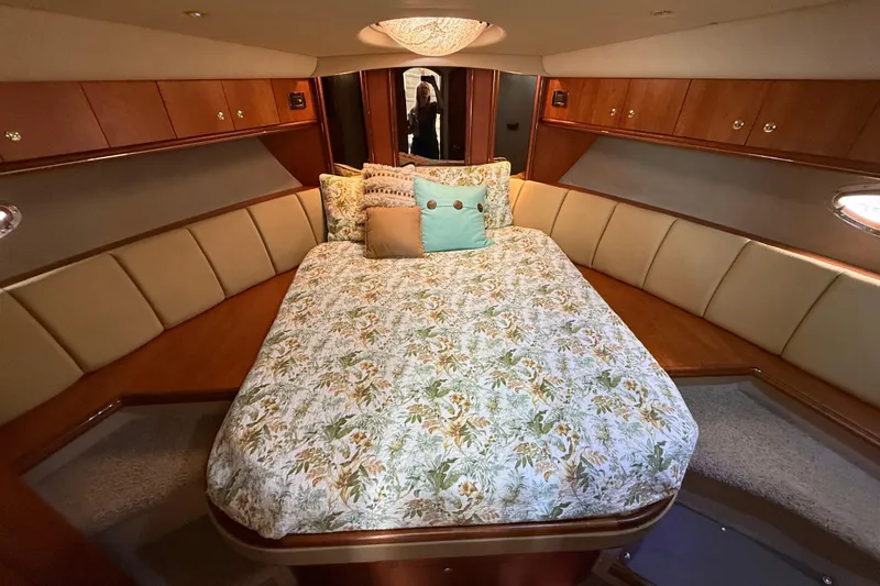 Slide: The Image of Luxurious bedroom interior of 2002 Cruisers Yachts 4450 Express Motoryacht with floral bedding. - 37