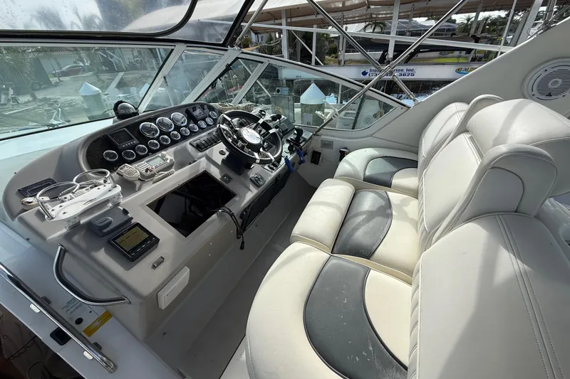 Slide: The Image of 2002 Cruisers Yachts 4450 Express Motoryacht helm with dual seating and instrument panel. - 42