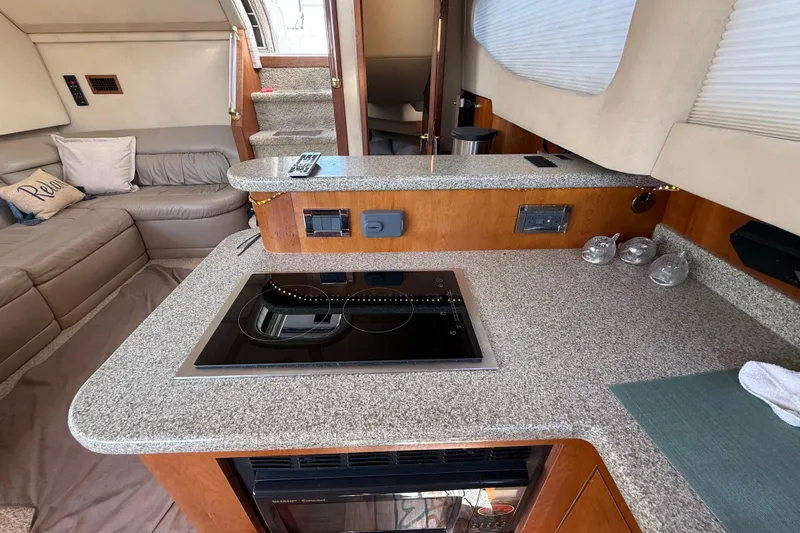 Slide: The Image of Luxurious 2002 Cruisers Yachts 4450 Express Motoryacht interior with modern kitchen amenities. - 52