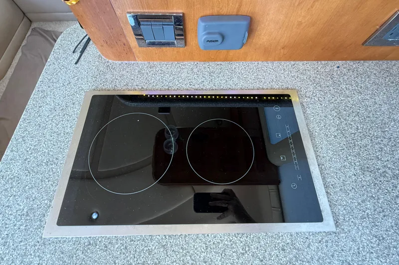 Slide: The Image of Built-in stovetop on 2002 Cruisers Yachts 4450 Express Motoryacht kitchen counter. - 53