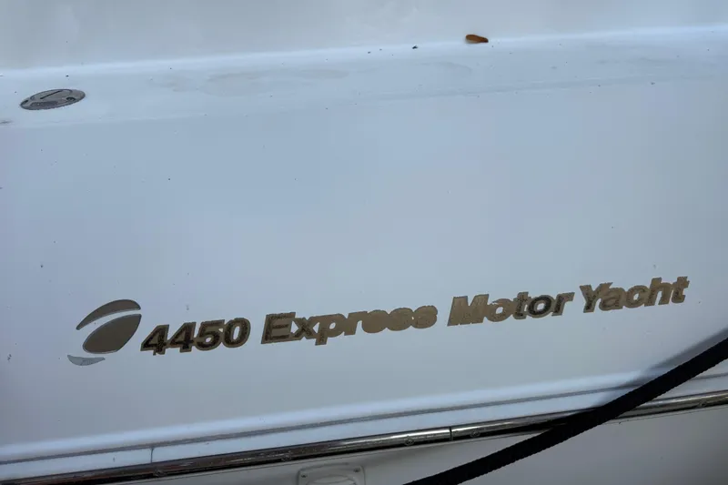 Slide: The Image of 2002 Cruisers Yachts 4450 Express Motoryacht logo on white hull. - 7