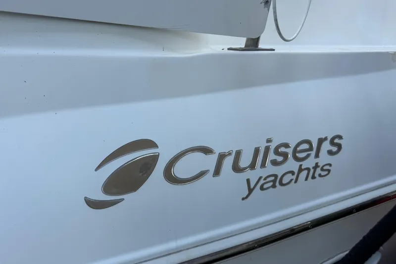 Slide: The Image of Cruisers Yachts logo on 2002 4450 Express Motoryacht exterior. - 8