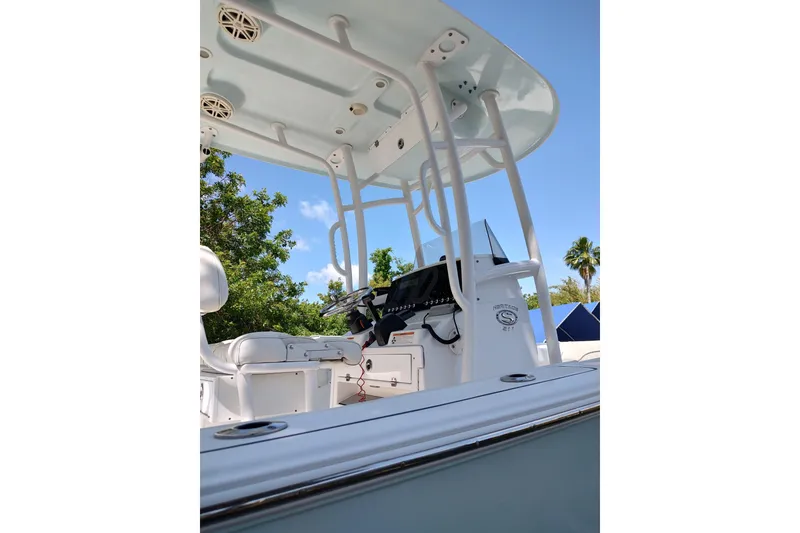 Slide: The Image of 2020 Sportsman Heritage 211 Center Console boat interior with steering console and seating. - 15