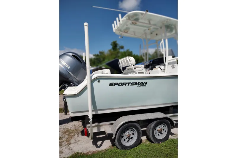 Slide: The Image of 2020 Sportsman Heritage 211 Center Console boat on trailer, featuring Yamaha engine. - 16