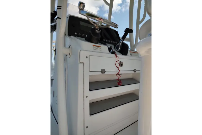 Slide: The Image of 2020 Sportsman Heritage 211 Center Console dashboard with steering wheel and controls. - 27