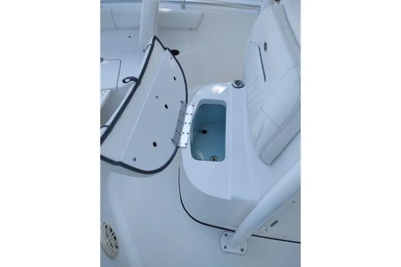 Slide: The Image of 2020 Sportsman Heritage 211 Center Console boat interior with open storage compartment. - 29