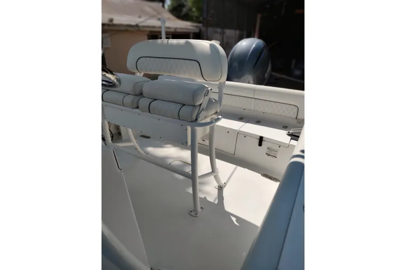 Slide: The Image of 2020 Sportsman Heritage 211 Center Console boat interior with cushioned seating. - 30