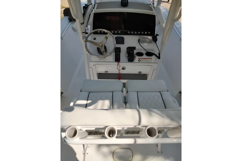 Slide: The Image of 2020 Sportsman Heritage 211 Center Console boat interior with steering wheel and seating. - 31