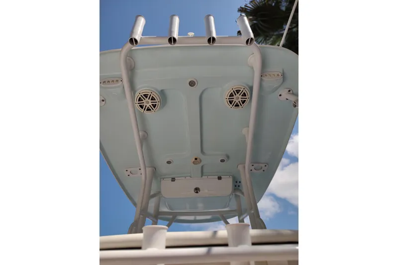Slide: The Image of 2020 Sportsman Heritage 211 Center Console boat's underside view with rod holders and speakers. - 33