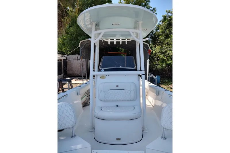 Slide: The Image of 2020 Sportsman Heritage 211 Center Console boat with T-top and cushioned seating. - 34