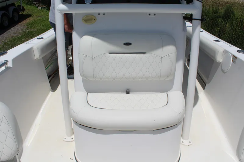 Slide: The Image of 2020 Sportsman Heritage 211 Center Console boat with white cushioned seating. - 44