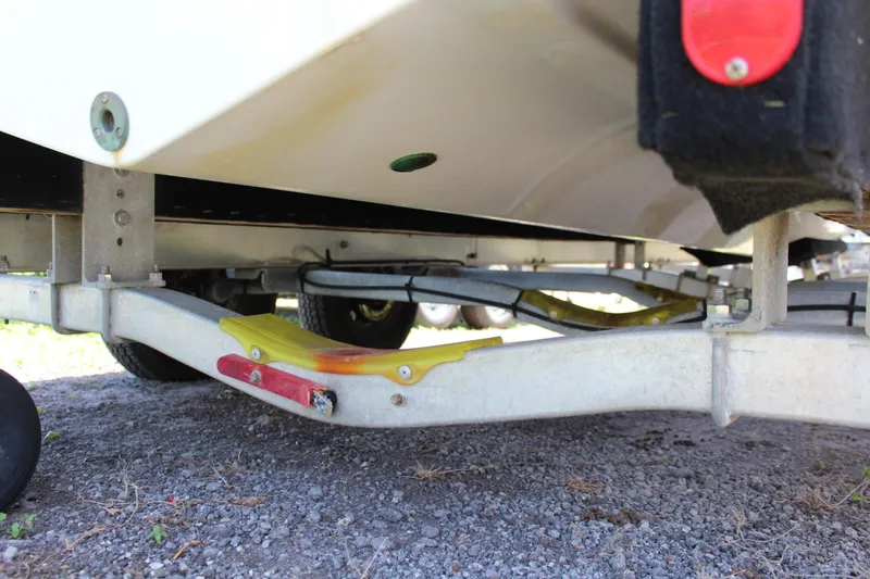 Slide: The Image of 2020 Sportsman Heritage 211 Center Console boat trailer underside view. - 49