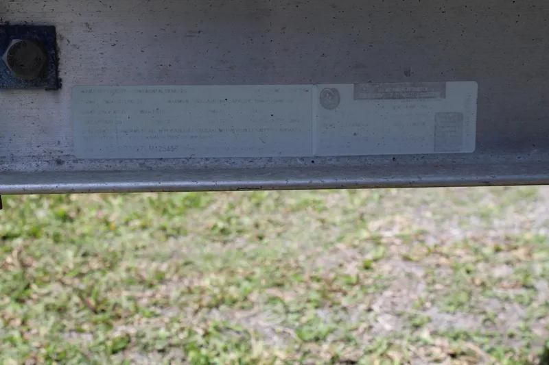 Slide: The Image of 2020 Sportsman Heritage 211 Center Console identification plate on a metal surface. - 51