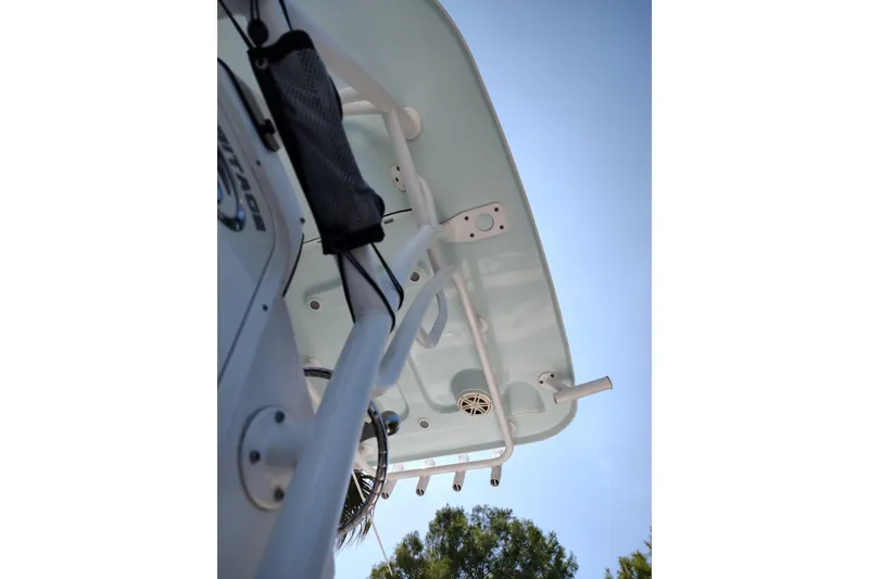 Slide: The Image of 2020 Sportsman Heritage 211 Center Console boat, viewed from below against a clear sky. - 8
