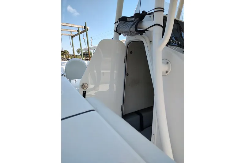 Slide: The Image of 2020 Sportsman Heritage 211 Center Console boat interior with open storage compartment. - 9