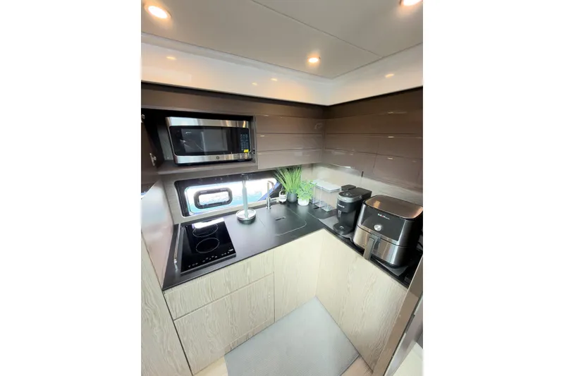 Slide: The Image of Modern kitchen interior on 2018 Azimut Atlantis 43 yacht with appliances and sleek design. - 10