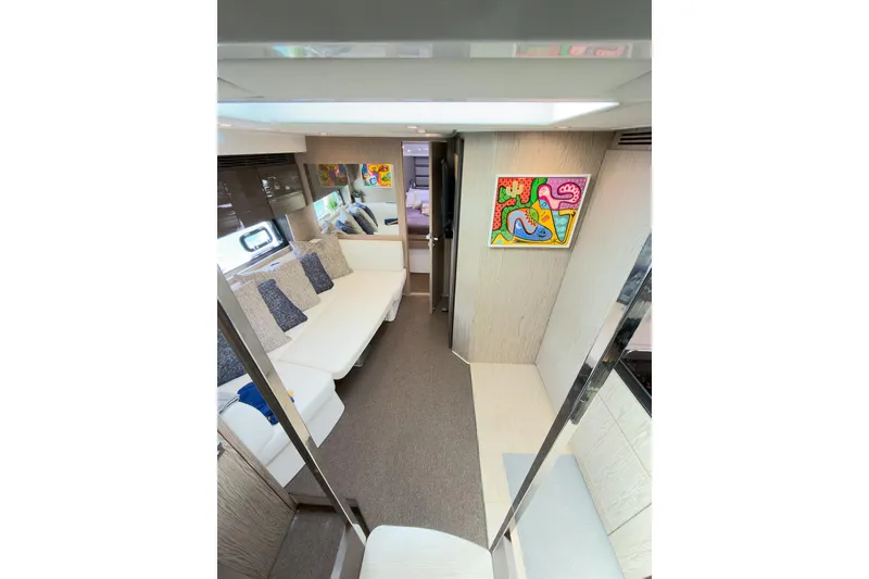 Slide: The Image of Interior of 2018 Azimut Atlantis 43 yacht with modern decor and colorful artwork. - 11