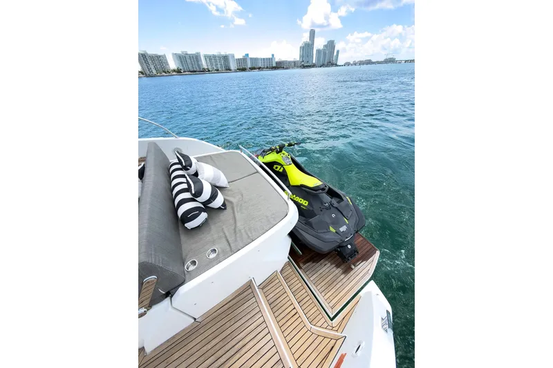Slide: The Image of Azimut Atlantis 43 yacht with Sea-Doo jet ski on deck, ocean view. - 12