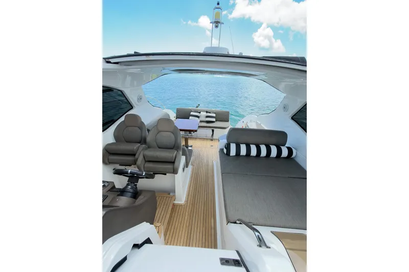 Slide: The Image of Luxurious 2018 Azimut Atlantis 43 yacht interior with plush seating and ocean view. - 15