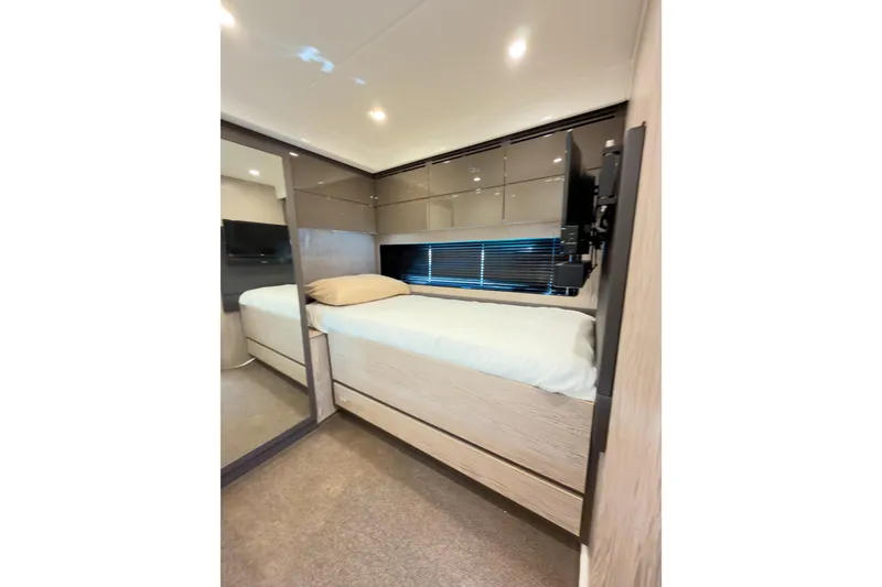 Slide: The Image of Interior cabin of 2018 Azimut Atlantis 43 yacht, featuring a cozy bed and modern design. - 19
