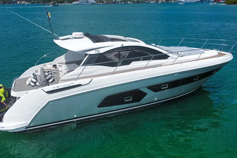 Slide: The Image of 2018 Azimut Atlantis 43 yacht on clear blue water, showcasing sleek design and luxury features. - 5