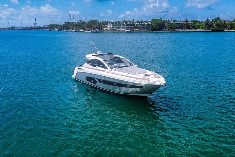 Slide: The Image of 2018 Azimut Atlantis 43 yacht cruising on clear blue waters under a sunny sky. - 8
