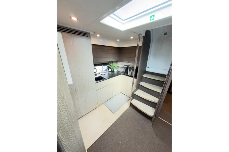 Slide: The Image of Modern kitchen interior of 2018 Azimut Atlantis 43 yacht with sleek design and staircase. - 9