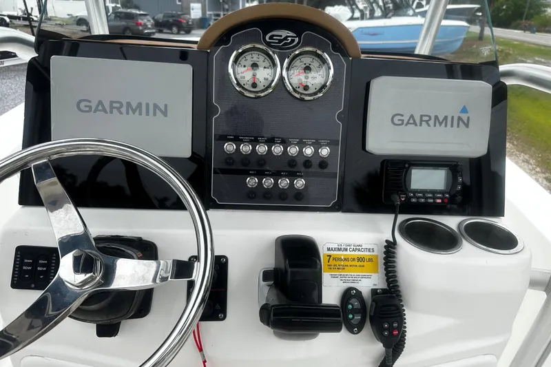 Slide: The Image of 2016 Sea Fox 186 Commander dashboard with Garmin displays and steering wheel. - 4