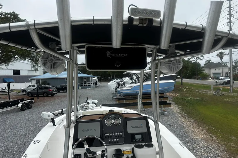 Slide: The Image of 2016 Sea Fox 186 Commander boat with Garmin electronics and T-top, parked on gravel lot. - 5