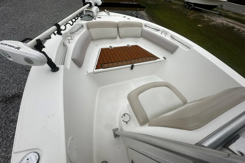 Slide: The Image of 2016 Sea Fox 186 Commander boat interior with seating and Minn Kota trolling motor. - 9