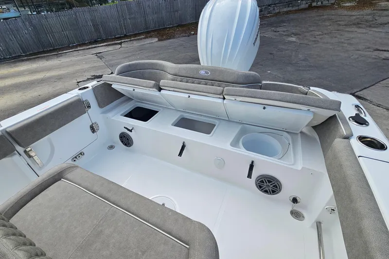 Slide: The Image of 2026 Sea Hunt Ultra 245 SE boat interior with seating and storage compartments. - 12