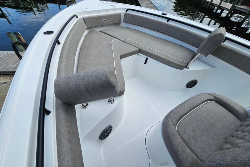 Slide: The Image of 2026 Sea Hunt Ultra 245 SE boat interior with cushioned seating and sleek design. - 20
