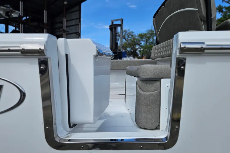 Slide: The Image of 2026 Sea Hunt Ultra 245 SE boat interior with seating and storage, showcasing modern design. - 4